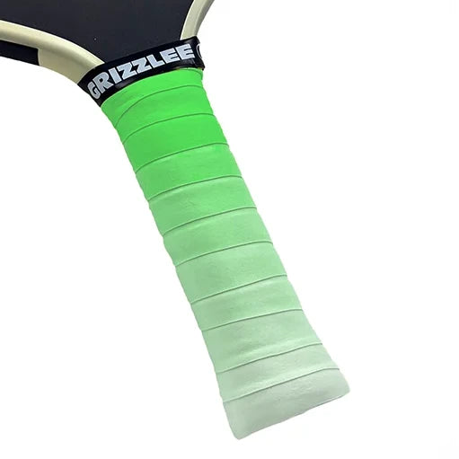 Close-up of a tennis racket handle with green grip and 'Grizzlee' branding on a white background