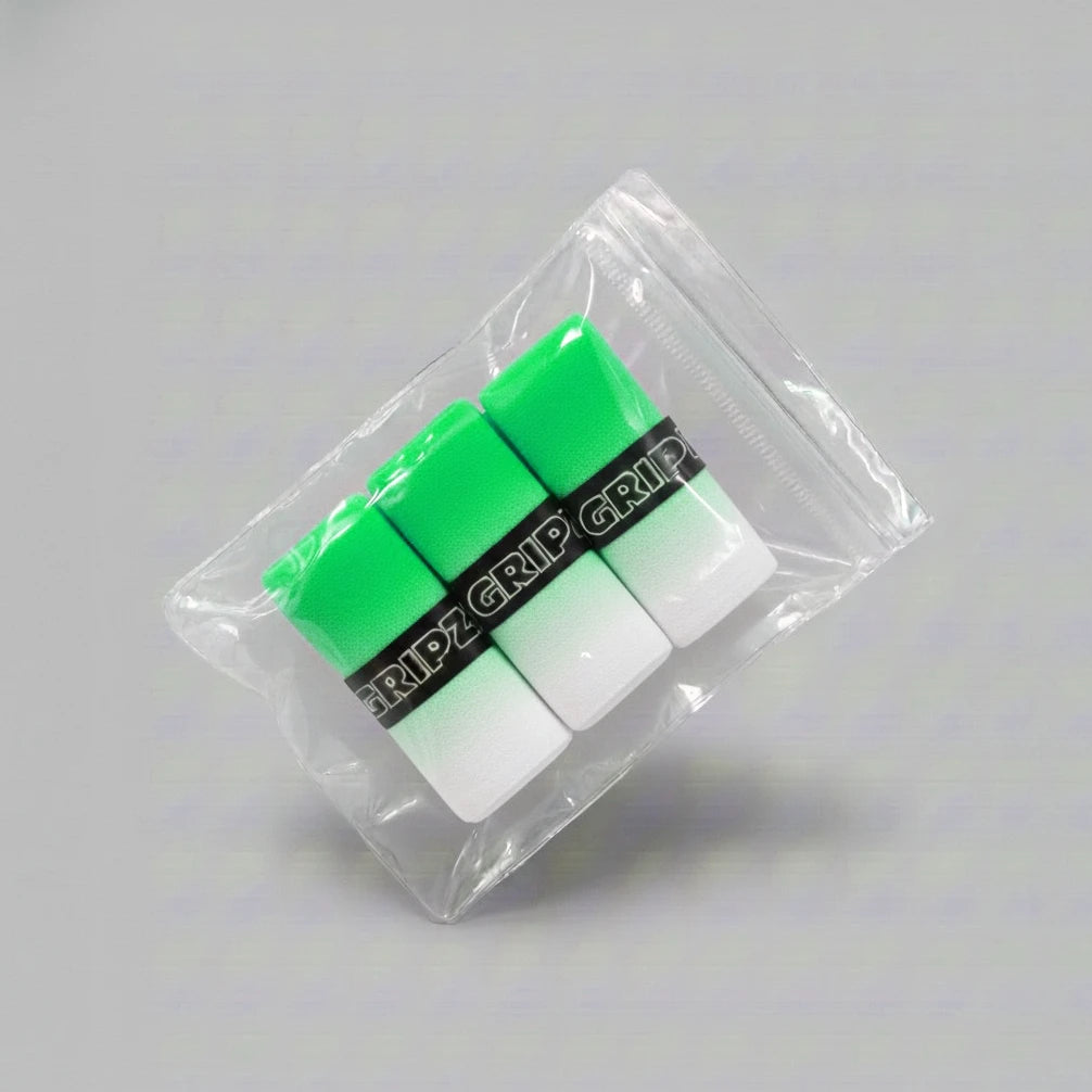 Grizzlee Gripz Packaged green and white overgrips with 'GRIPZ' branding on a gray background