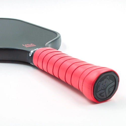  detailed close-up of the Red Grizzlee Gripz Overgrip, highlighting its eco-friendly materials and 0.56mm thickness for a secure, sweat-resistant pickleball grip that enhances control.

